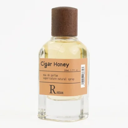 RABDAN Cigar Honey 50ML EDP is a luxurious fragrance for men, blending sweet honey and cloves with a heart of tobacco and vanilla, resting on a warm base of oud and sandalwood. This luxury perfume is a top choice among UAE perfumes for its bold and elegant profile.