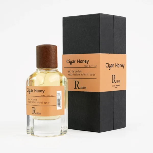 RABDAN Cigar Honey 50ML EDP is a luxurious fragrance for men, blending sweet honey and cloves with a heart of tobacco and vanilla, resting on a warm base of oud and sandalwood. This luxury perfume is a top choice among UAE perfumes for its bold and elegant profile.