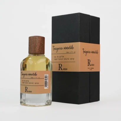 RABDAN Tangerine Immortelle 50ML EDP is a luxury fragrance for women, featuring fresh tangerine and aldehydes with a soft heart of immortelle and patchouli, and a warm base of vanilla, suede, and amber. A must-have UAE perfume that combines freshness with sophistication.